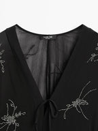 Flowing midi dress with embroidery