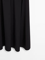 Long halter neck dress with flounce