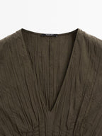 Creased-effect long pleated dress