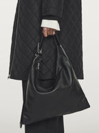 Long water-repellent oversize quilted parka