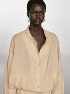 Loose-fitting bomber jacket with drawstring detail