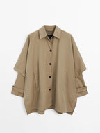Cape trench coat with long sleeves
