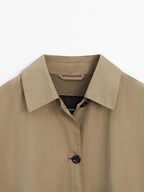 Cape trench coat with long sleeves