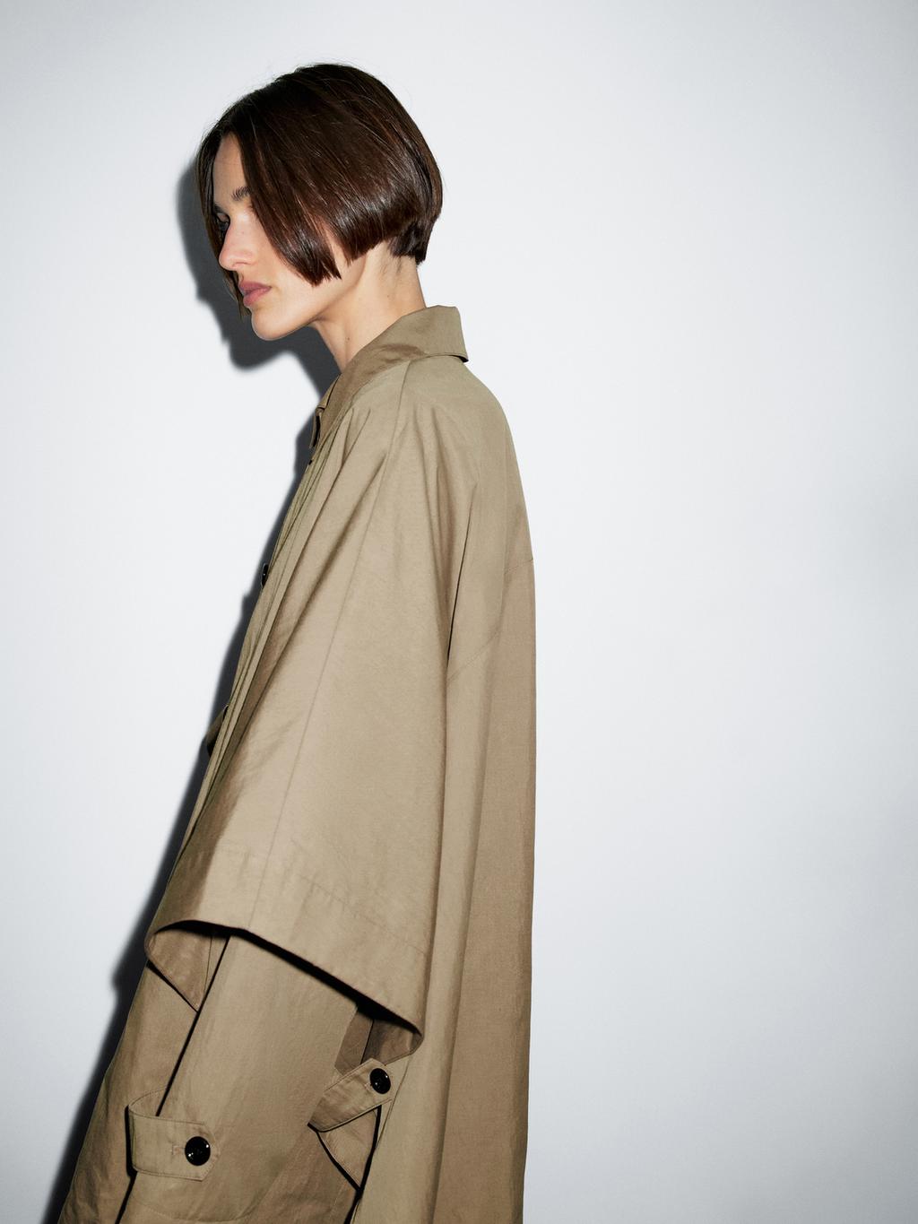 Cape trench coat with long sleeves