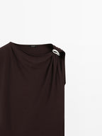Draped neckline top with brooch detail