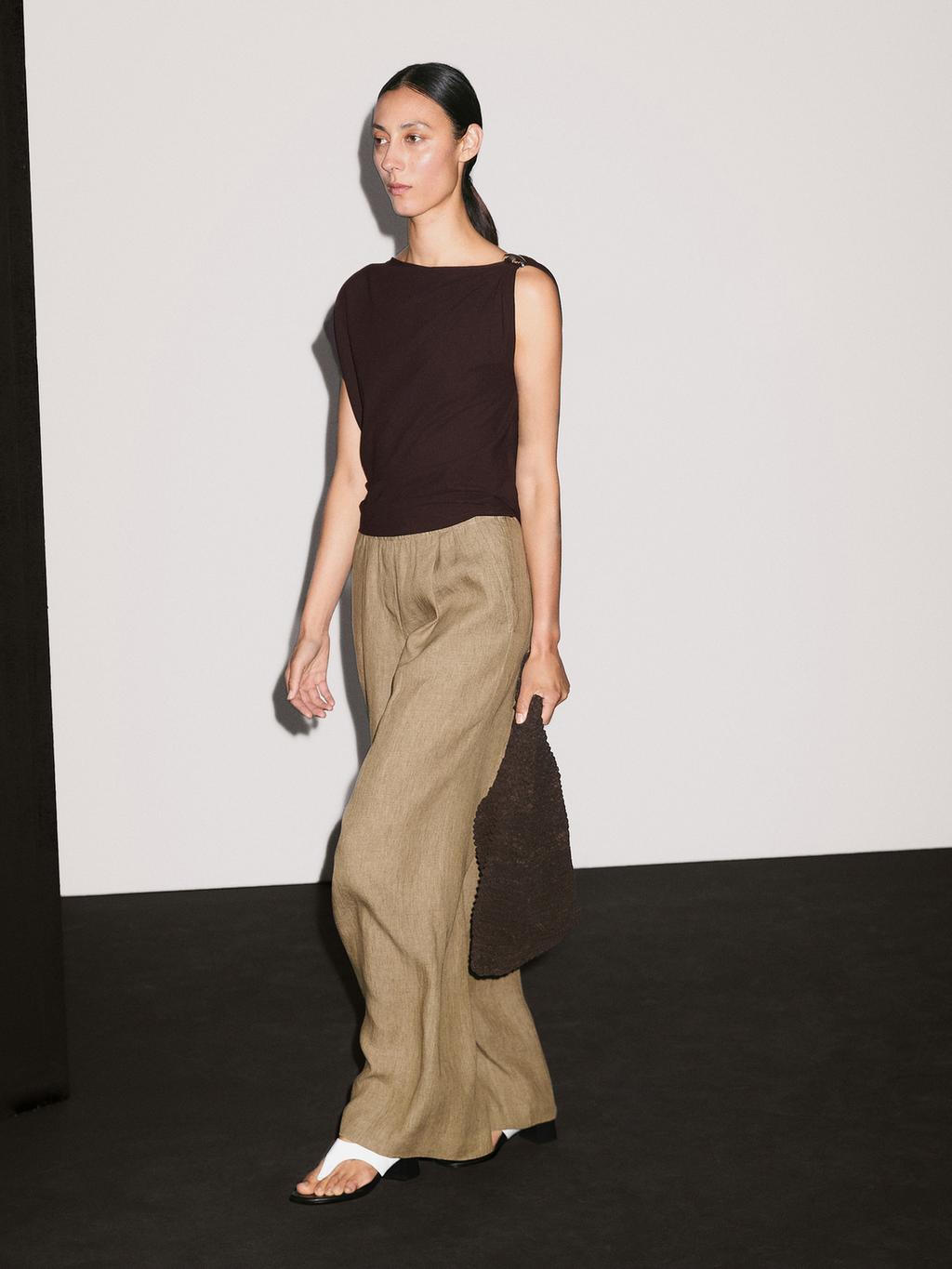 Draped neckline top with brooch detail