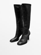 High-heel boots with elastic gores on the leg