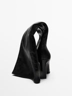 High-heel boots with elastic gores on the leg