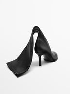 High-heel boots with rounded vamp