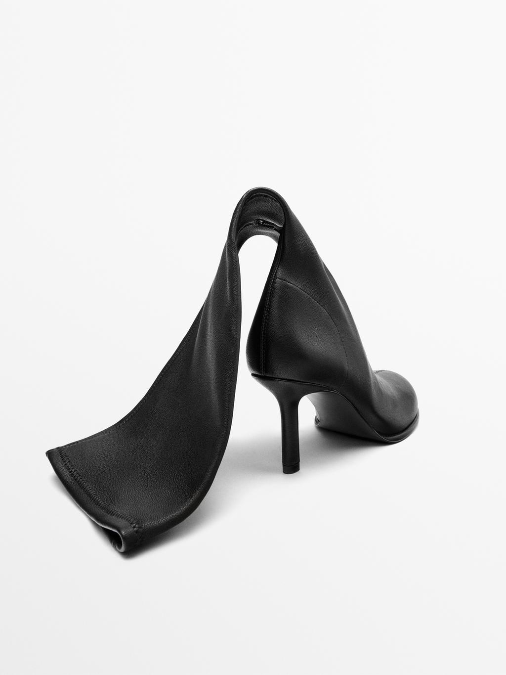 High-heel boots with rounded vamp