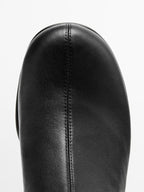 High-heel boots with rounded vamp