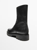 Track sole flat ankle boots