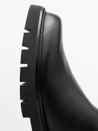 Track sole flat ankle boots