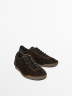Leopard print hair on leather trainers