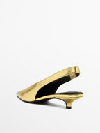Gold high-heel slingback shoes
