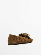 Split suede loafers with fringing