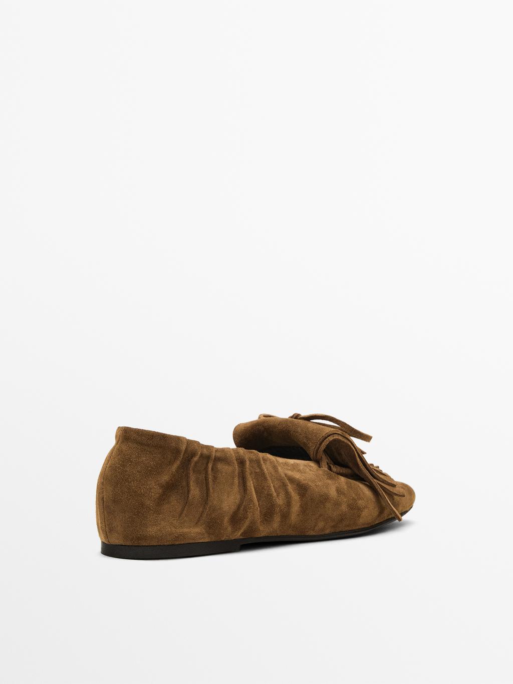 Split suede loafers with fringing