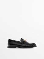 Crackled leather loafers with decorative detail