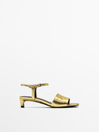 Golden slide sandals